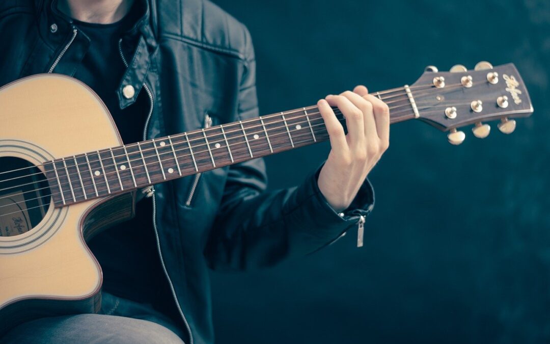 a person playing the guitar