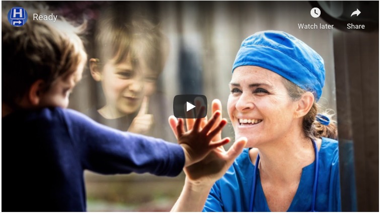 healthcare worker playing with a child