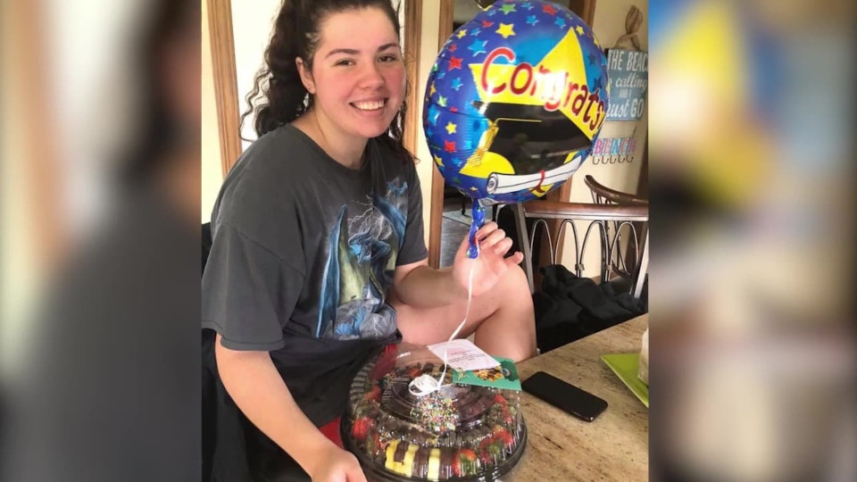 woman with a cake and balloon