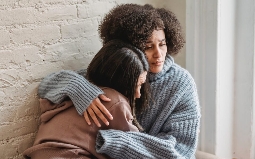 women hugging