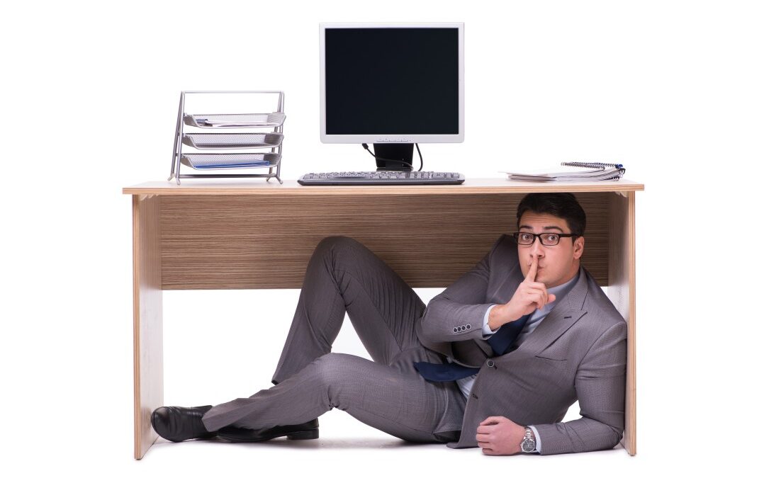 man hiding under the table